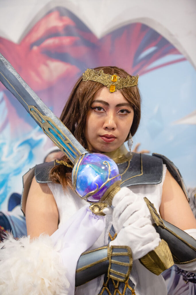 Neptys is a Singapore cosplayer who made an Elspeth Tirel costume for the MTG March of the Machine Carnival.